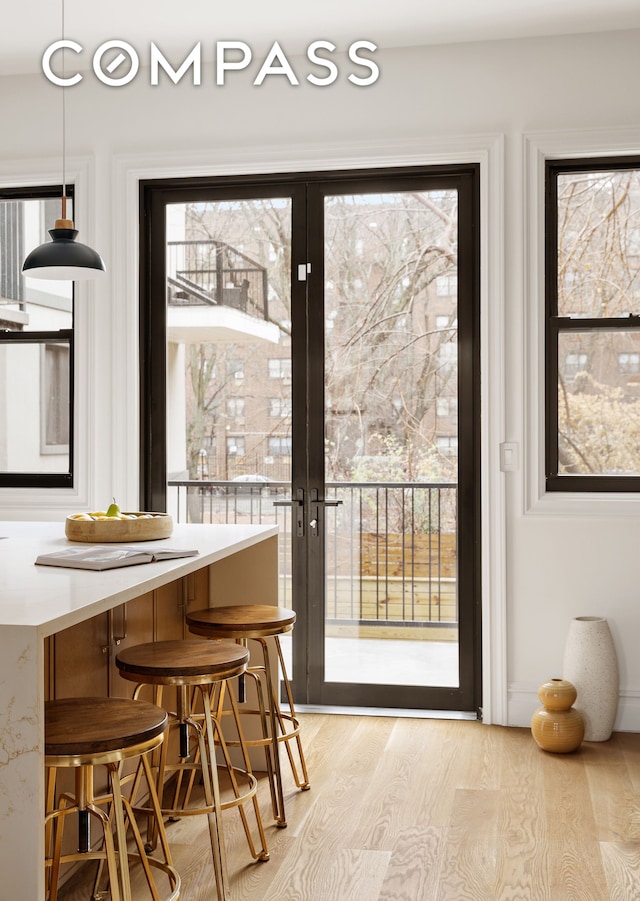 entryway featuring breakfast area and light hardwood / wood-style flooring