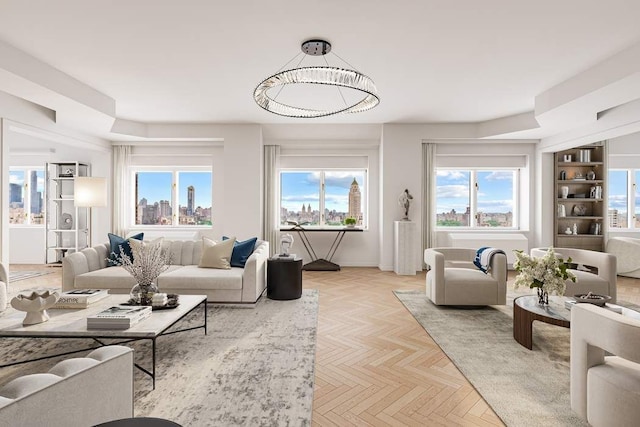 living room with a wealth of natural light and light parquet flooring