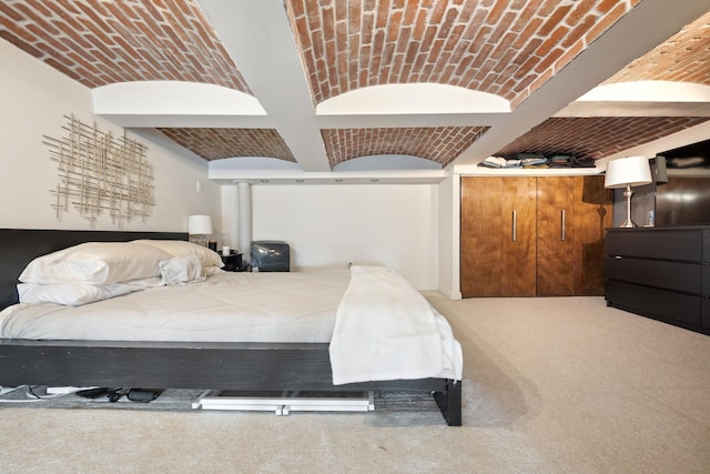 bedroom featuring coffered ceiling, brick ceiling, and beamed ceiling