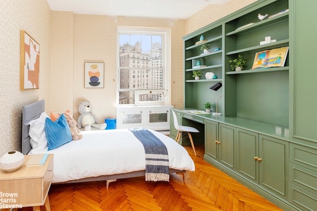 bedroom with light parquet flooring