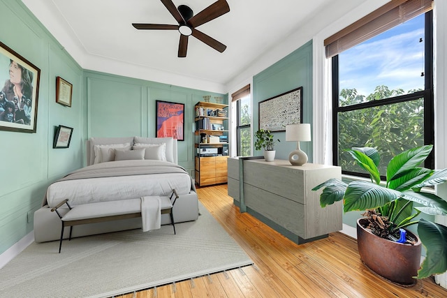 bedroom featuring ceiling fan and light wood-type flooring