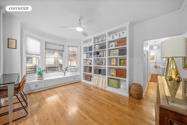 interior space with ceiling fan, light hardwood / wood-style floors, and ornamental molding