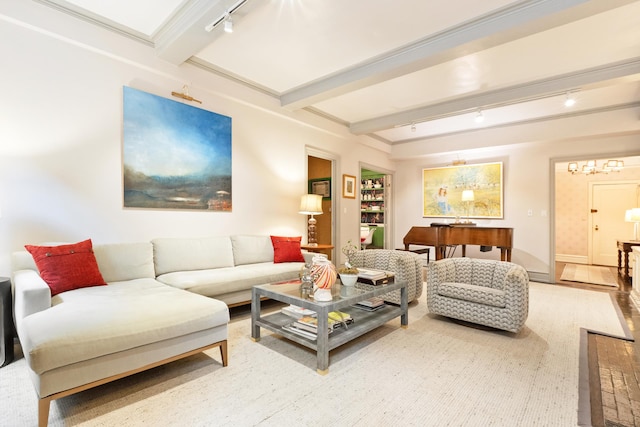 living room with beamed ceiling and track lighting