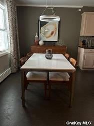 dining area with an inviting chandelier