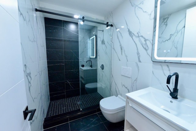 bathroom featuring tile walls, vanity, tiled shower, and toilet