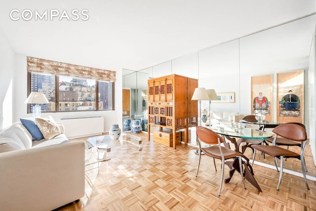 dining space with light parquet floors