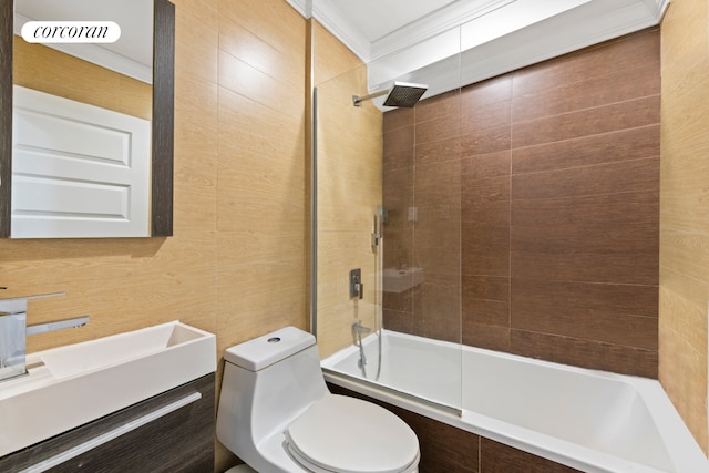 full bathroom featuring ornamental molding, tiled shower / bath combo, vanity, and toilet