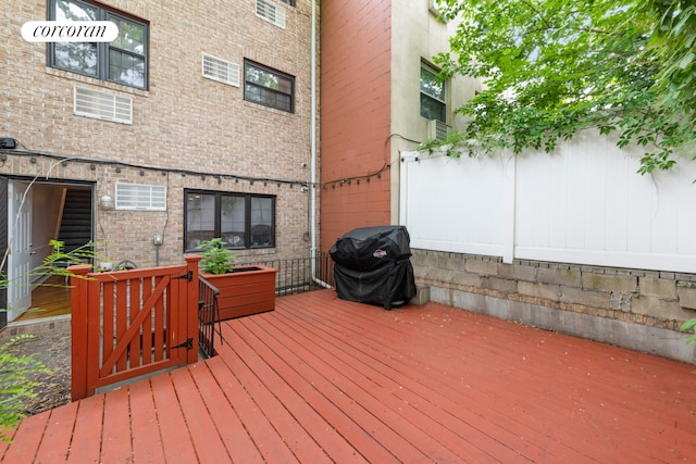 wooden deck featuring grilling area