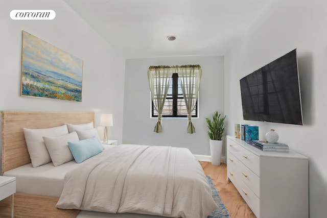 bedroom with light wood-type flooring