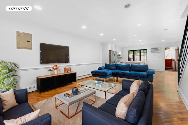 living room featuring electric panel, light wood-type flooring, and a baseboard radiator