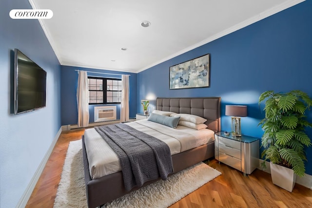 bedroom featuring ornamental molding, cooling unit, and hardwood / wood-style floors