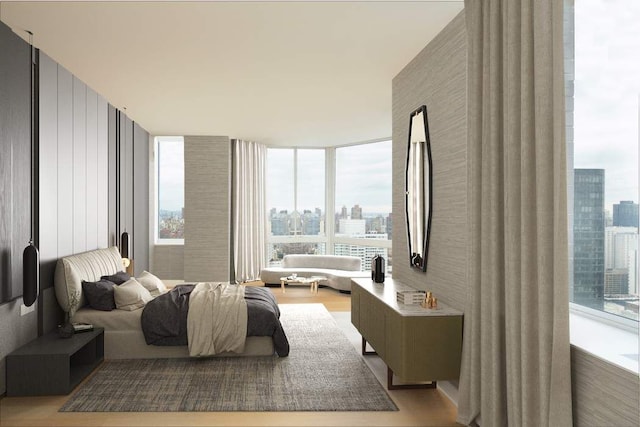 bedroom featuring a wall of windows, light hardwood / wood-style flooring, and multiple windows