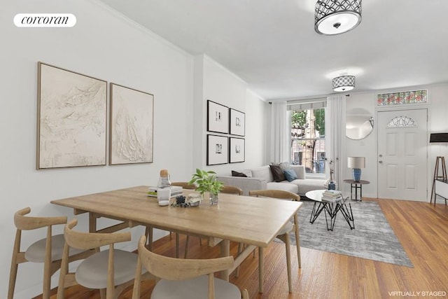 dining space with hardwood / wood-style flooring