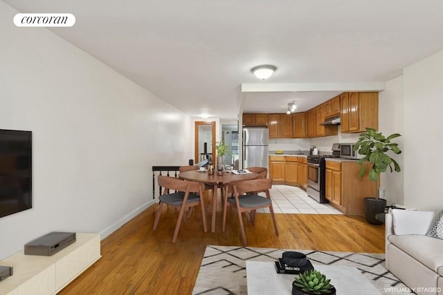 interior space with stainless steel appliances and light wood-type flooring