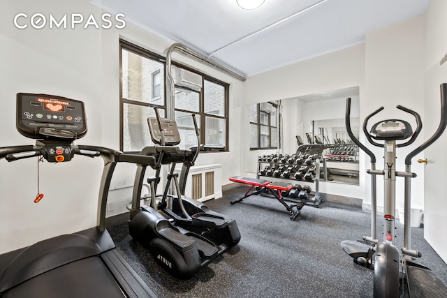 exercise room with a wall mounted AC