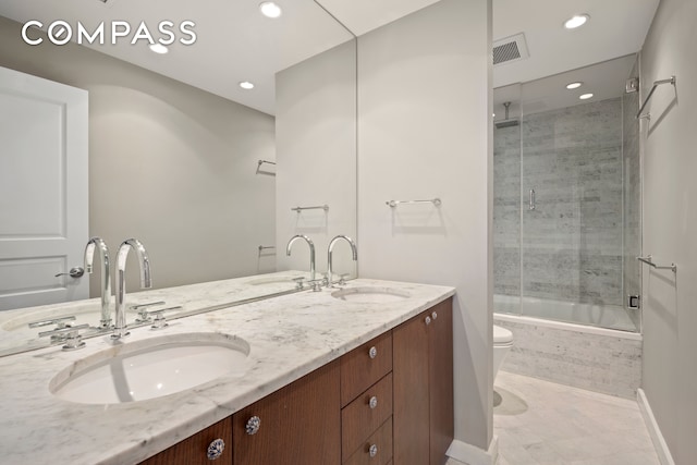 full bathroom with vanity, toilet, tile patterned floors, and combined bath / shower with glass door