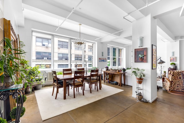 dining area with an inviting chandelier