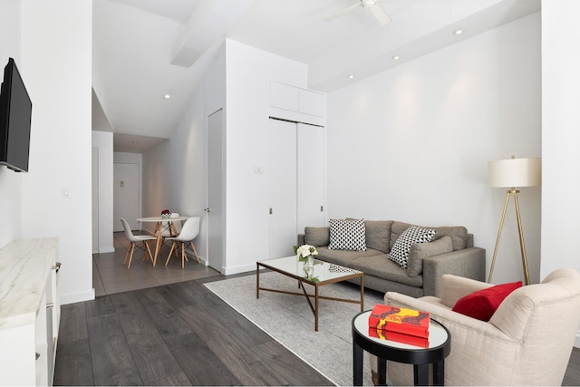 living room with dark hardwood / wood-style floors and ceiling fan