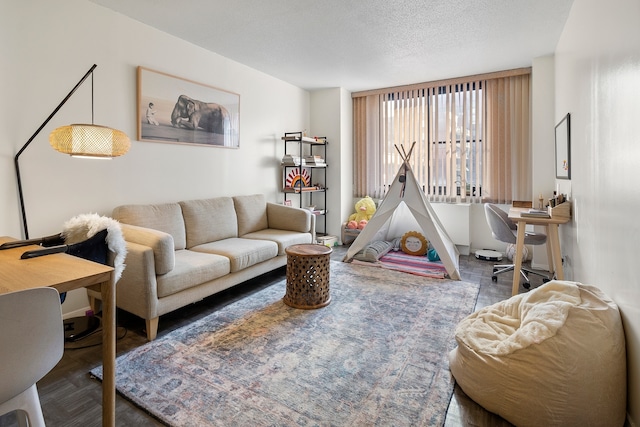 living room with parquet flooring and a textured ceiling