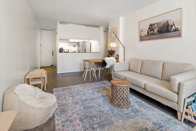 living room featuring dark parquet flooring