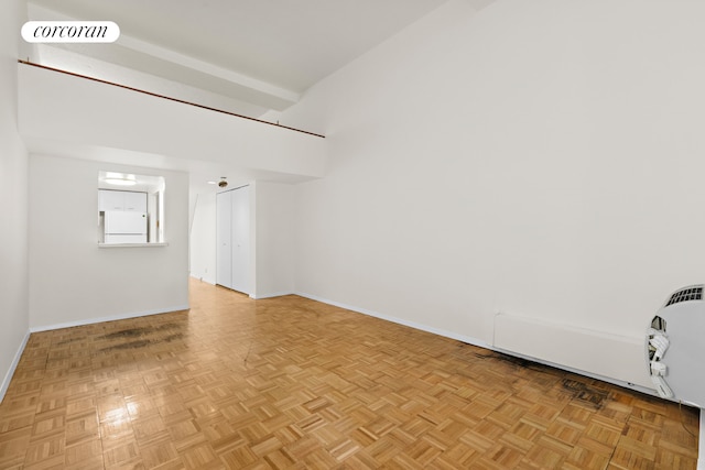 unfurnished room featuring light parquet floors