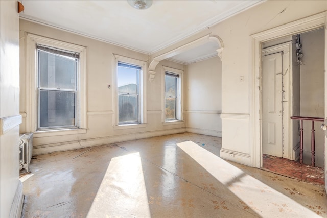 unfurnished room with ornamental molding