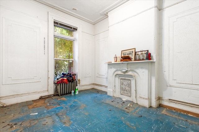 unfurnished living room with crown molding