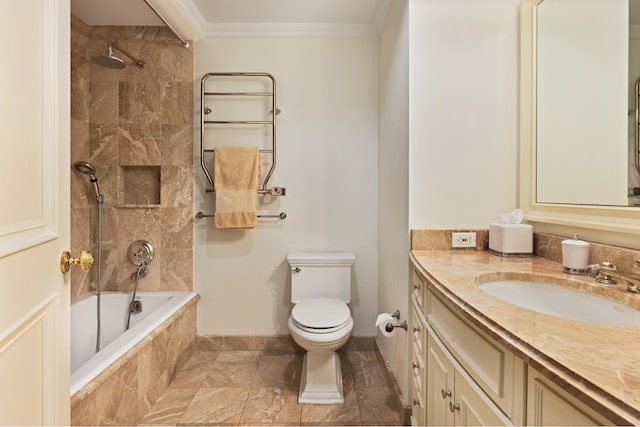 full bathroom featuring vanity, tiled shower / bath combo, toilet, and crown molding