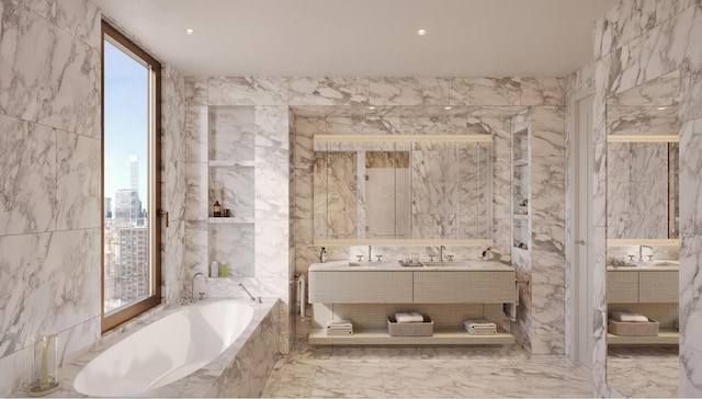 bathroom with vanity, a relaxing tiled tub, and tile walls