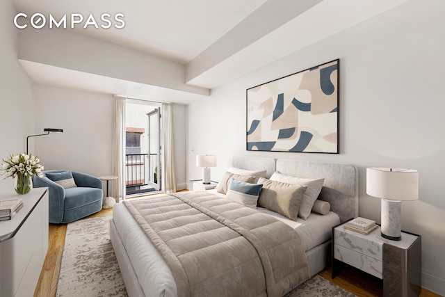 bedroom featuring light hardwood / wood-style flooring and access to outside