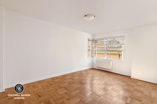 unfurnished room with light parquet flooring