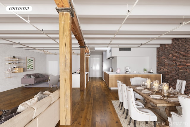 dining room featuring brick wall, dark wood-type flooring, and ceiling fan