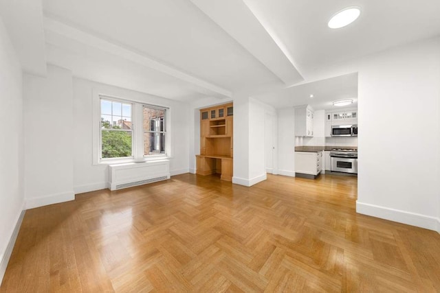 unfurnished living room with light parquet floors