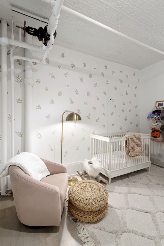 bedroom featuring a nursery area