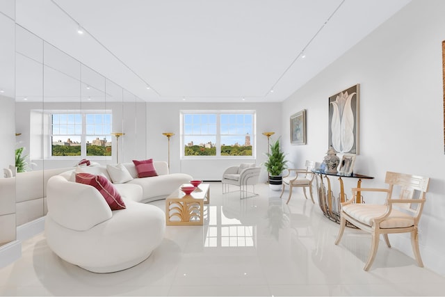 living room featuring a healthy amount of sunlight and light tile patterned flooring