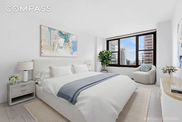 bedroom with light hardwood / wood-style flooring