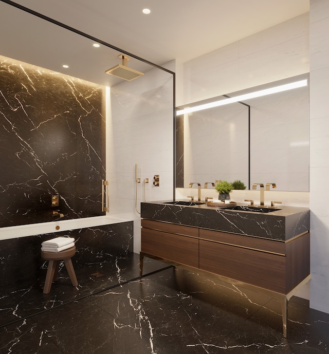 bathroom with tile walls, vanity, and walk in shower