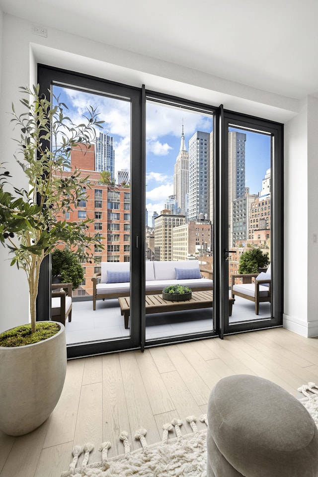 doorway to outside with hardwood / wood-style floors