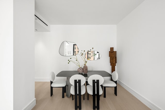 dining room with light hardwood / wood-style floors