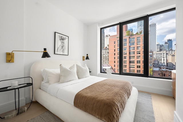 bedroom featuring wood-type flooring