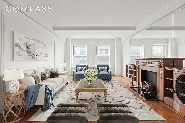 living room featuring crown molding and beamed ceiling