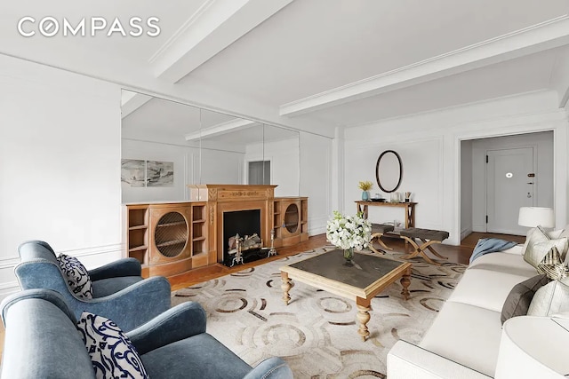 living room featuring beam ceiling and wood-type flooring