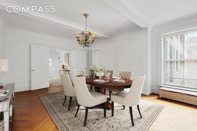 dining area with radiator, parquet floors, a notable chandelier, and ornamental molding