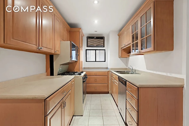 kitchen with white gas stove, sink, dishwasher, a wall unit AC, and light tile patterned floors