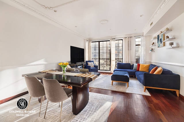 living room with hardwood / wood-style floors and ornamental molding