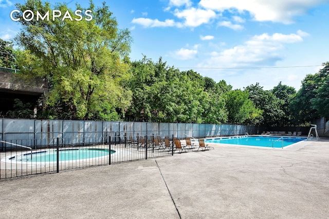 view of swimming pool featuring a patio