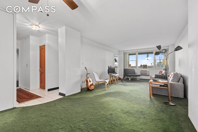 carpeted living room featuring ceiling fan