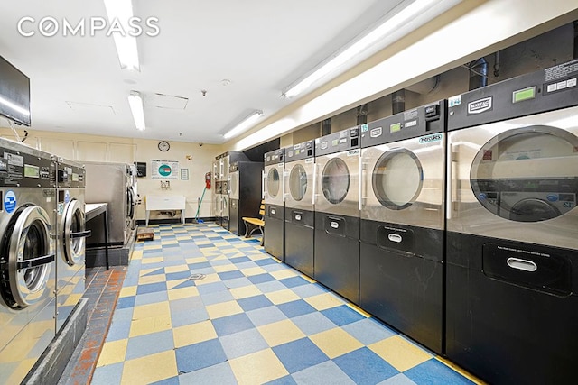 laundry room with independent washer and dryer and stacked washing maching and dryer