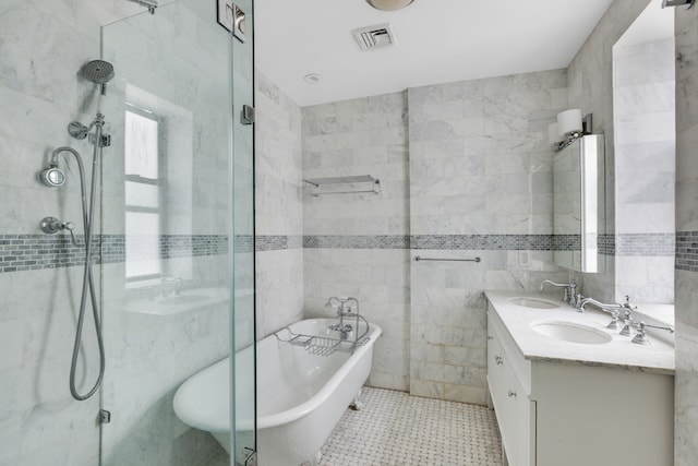 bathroom featuring vanity, tile walls, separate shower and tub, and tile patterned flooring