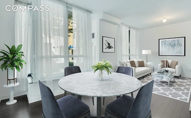 dining area with dark hardwood / wood-style floors